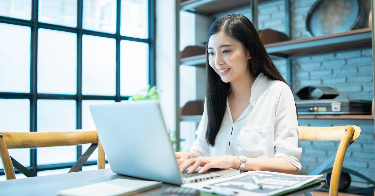 Accountant managing accounts payable from her laptop